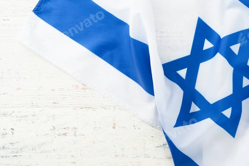 Preview: Independence Day of Israel. National Israel flag with star of David over white wooden background. Cl
