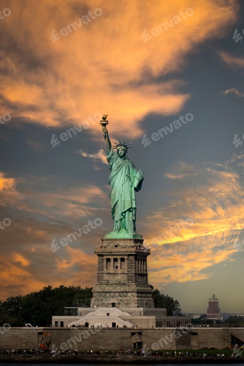 Preview: Vertical panorama oThe Statue Of Liberty with dramatic sunset behind
