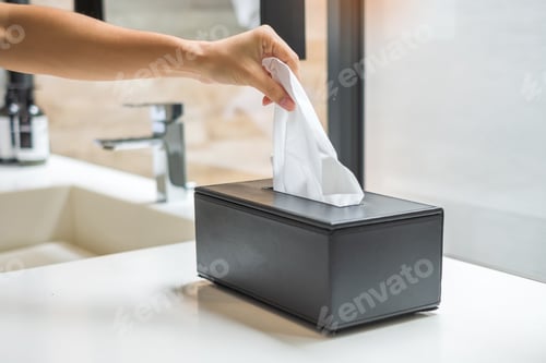 Preview: hand pulling toilet paper in bathroom. Cleaning, Lifestyle and personal hygiene concept