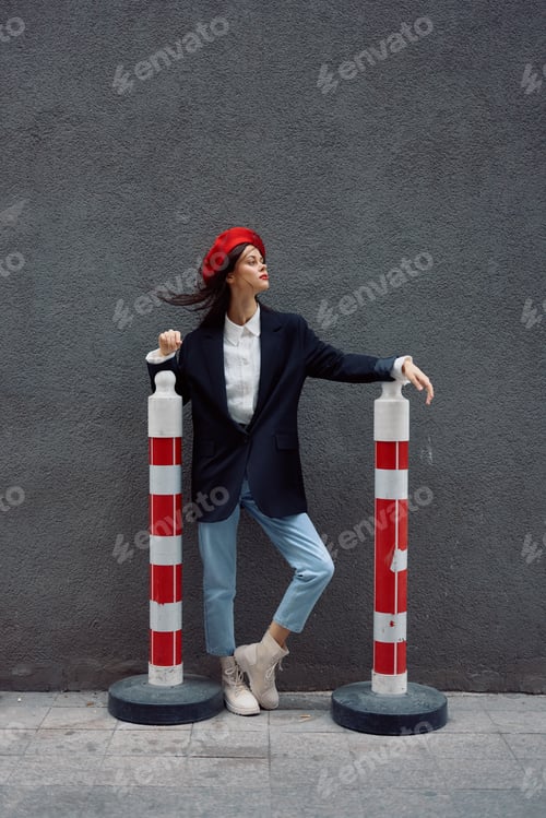 Preview: Fashion woman standing on the street in front of the city and road works tourist in stylish clothes