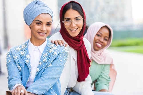 Preview: Beautiful muslim girl wearing hijab bonding outdoors