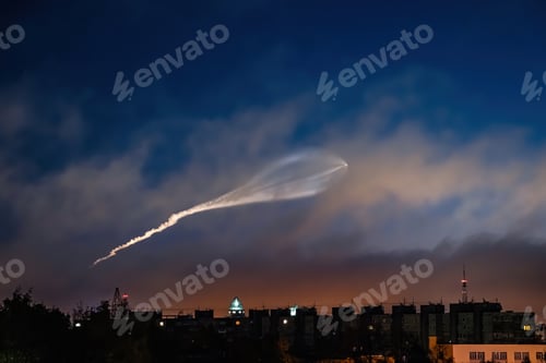 Preview: Soyuz space rocket launch. Space jellyfish in sky. Plume of rocket gases in sun at dawn.