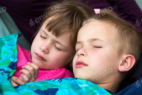 Preview: Close-up portrait of two small adorable cute blond children, brother and sister, boy and girl