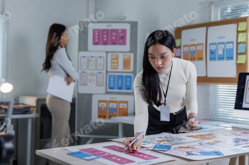 Preview: Designer planning user interface for mobile application