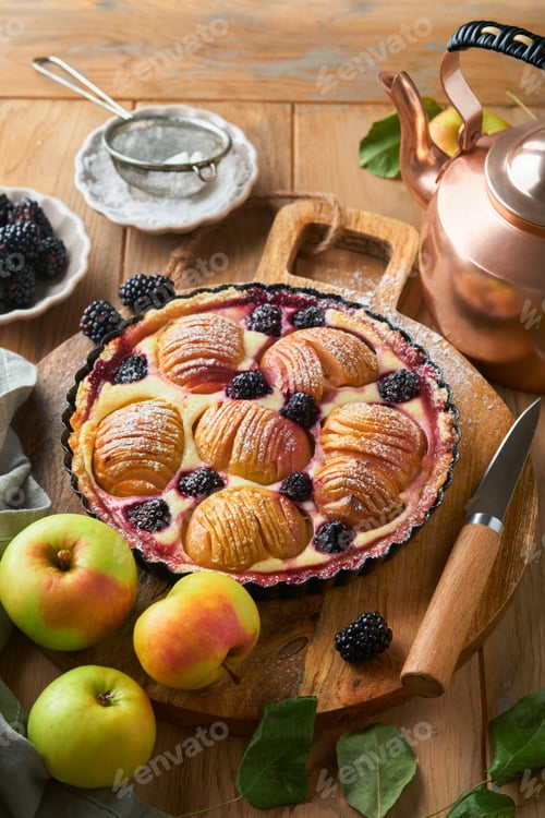 Preview: Apple pie. Apple and blackberries cake or pie decorated sugar powder on old wooden table. Delicious