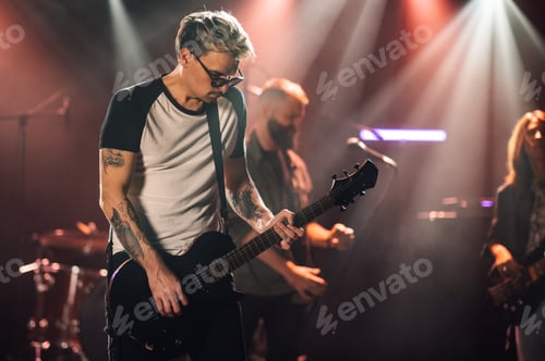Preview: Guitarist performing live on stage with band
