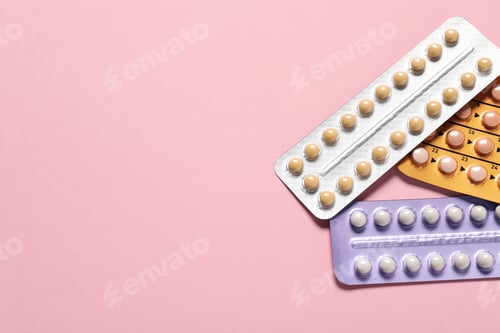 Preview: Blisters of oral contraceptive pills on pink background, flat lay. Space for text