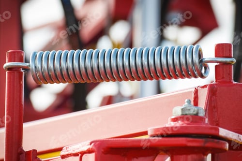 Preview: Hard spring made of steel. Part of big industrial or agricultural machine