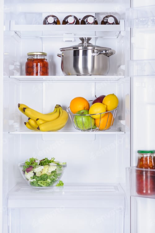 Preview: ripe fruits, salad, pan and preserved tomatoes in fridge