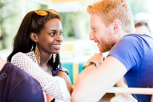 Preview: Romantic couple smiling while looking into each others eyes
