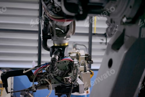 Preview: Engineer work at robotic arm factory.