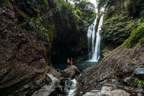 Preview: A couple in love on a waterfall. Honeymoon trip. Happy couple on the island of Bali