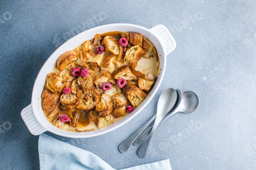 Preview: Croissant bread pudding with custard creamy sauce and vanilla ice cream very delicious dessert
