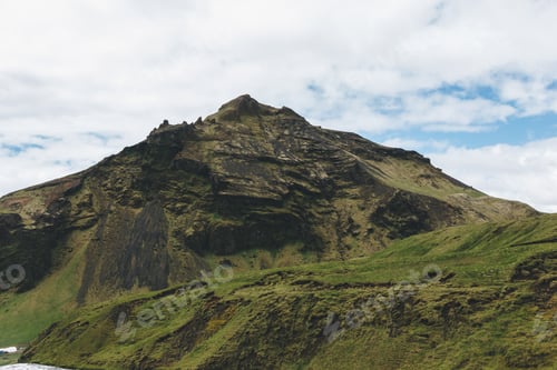 Preview: scenic view of landscape with mountain under cloudy blue sky in Iceland
