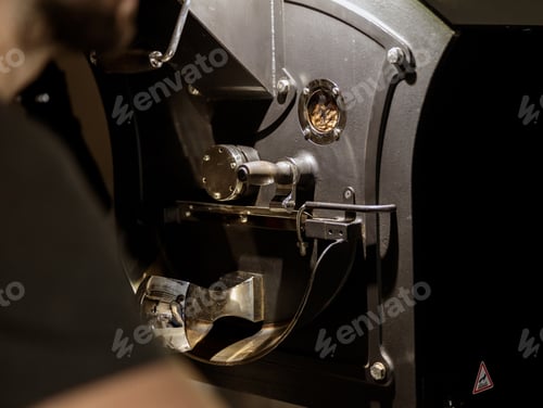 Preview: Modern coffee roasting machine with various metal parts