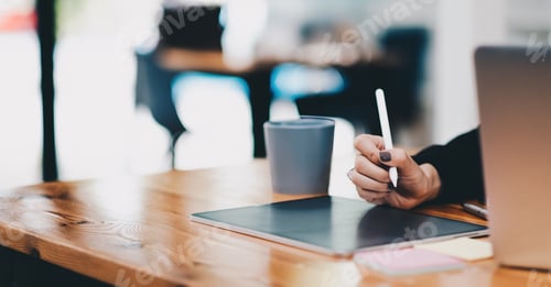 Preview: Close up Female hands drawing on digital tablet with electronic pen. Freelancer designer working