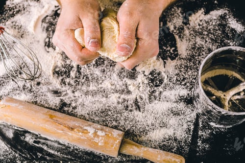 Preview: Hands kneading a dough