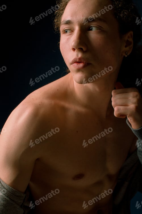 Preview: Attractive And Stylish Guy With Curly Hair And A Sports Figure