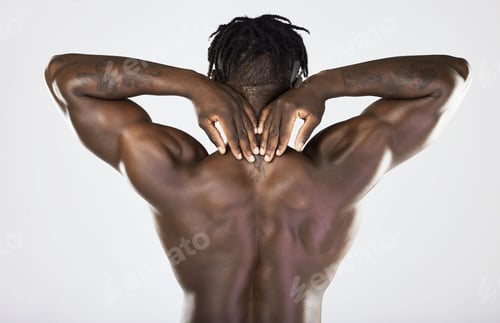 Preview: Back, body and muscular with a model black man posing in studio on a gray background for fitness or
