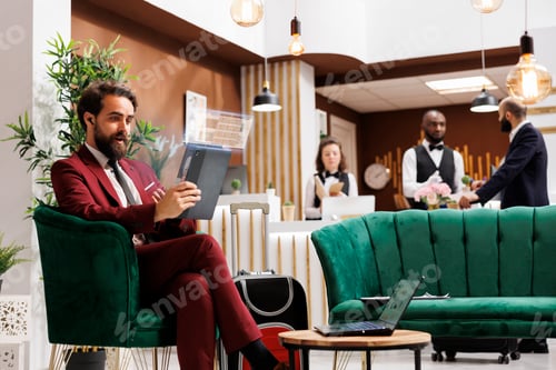 Preview: Businessman works in hotel
