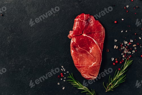Preview: Raw fitness beef steak on black background