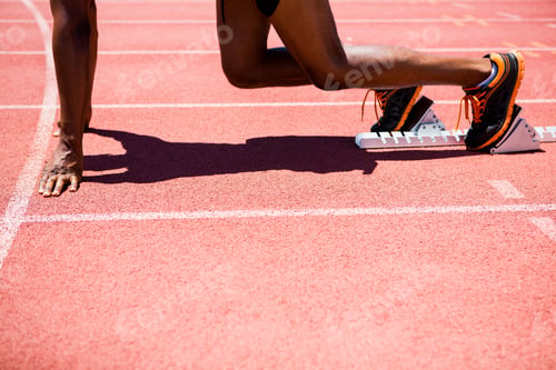 Preview: Athlete on a starting block about to run
