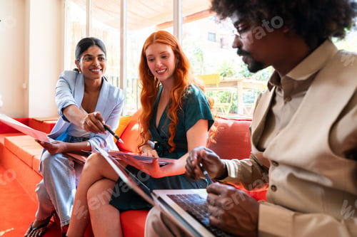 Preview: Multiethnic small group of businesspeople meeting in a coworking company office