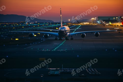 Preview: Airplane on the track at sunset time