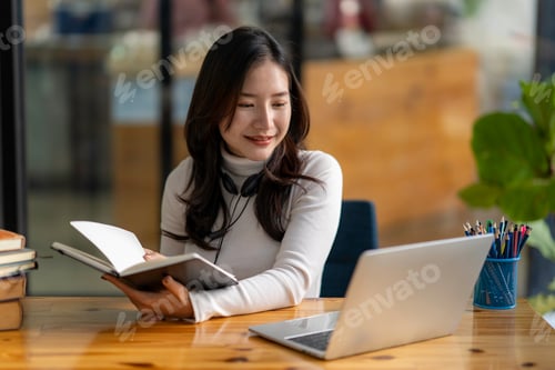 Preview: Education study abroad, Asian student girl look at laptop while doing homework making video call abr
