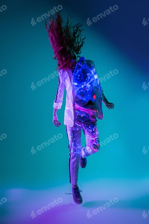 Preview: Woman jumping in neon light