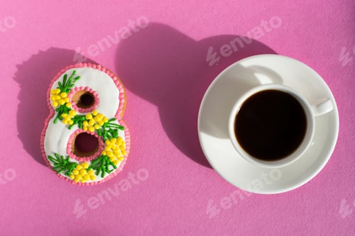 Preview: March 8 cake and coffee mug on a bright pink background.