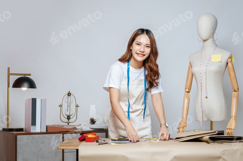 Preview: Portrait Young Fashion designer woman working in studio