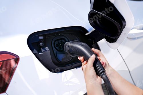 Preview: Unrecognizable Child’s Contribution to Eco-Friendly Living by Charging Electric Car