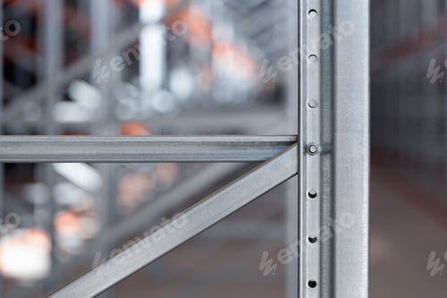 Preview: Background industrial metal shelving racks in a warehouse or factory