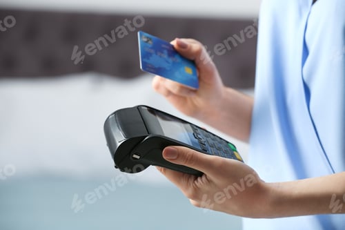 Preview: Woman using modern payment terminal indoors, closeup