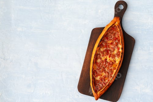 Preview: Turkish baked Pide bread on light blue wooden surface