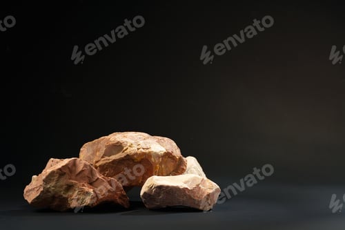 Preview: Pieces of granite stone on black background studio shot