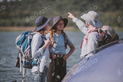 Preview: Family appears to be preparing for a hiking or camping expedition, as they are all equipped with bac