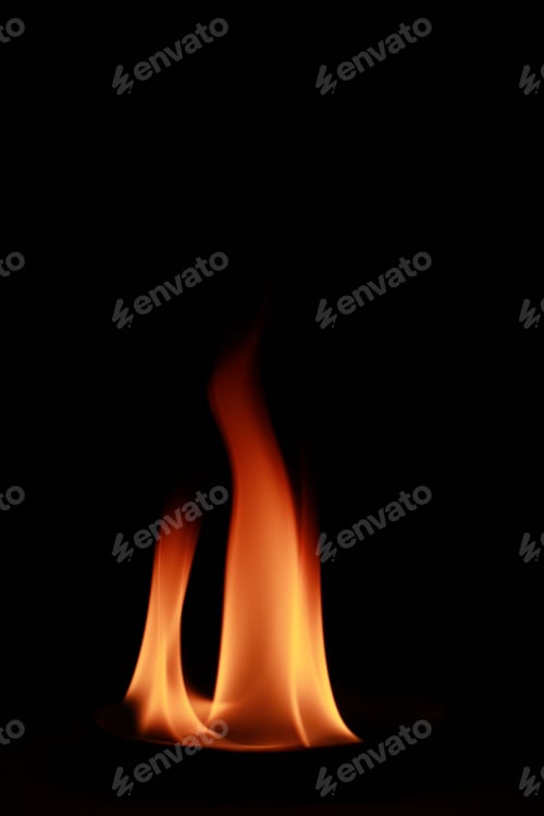 Preview: Vertical shot of flames isolated on a black background for textures