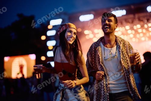 Preview: Laughing Couple Enjoying Music Festival at Night