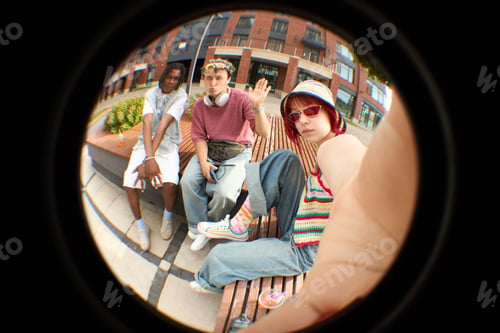 Aperçu: Portrait of Diverse Teenagers Sitting Outdoors and Taking Selfie Together