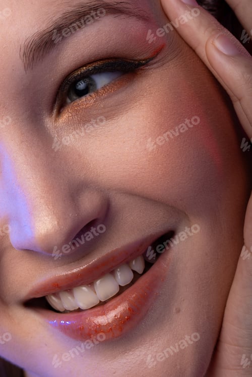 Preview: Close up of caucasian woman wearing eyeliner and lip gloss