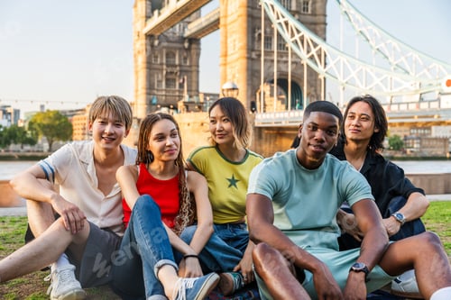 Preview: Multiracial group of happy young friends bonding in London