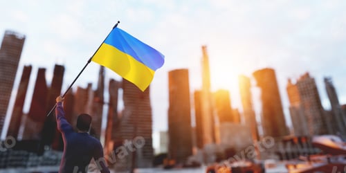 Preview: Man with Ukraine flag on city ruin. Ukrainian victory