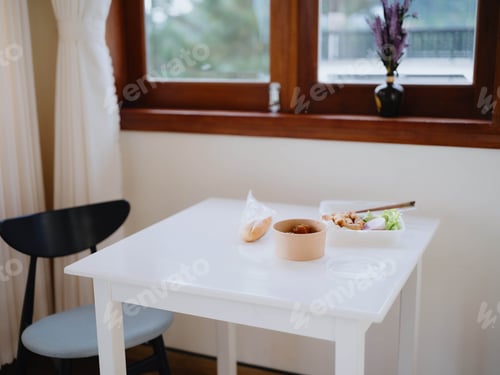 Preview: Food from delivery on the table in plastic utensils, a fast food concept