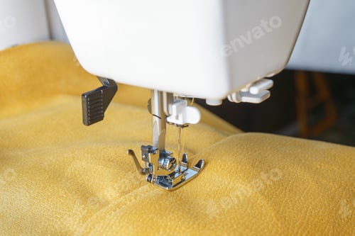 Preview: Modern Sewing Machine With Yellow Velours Fabric Close Up