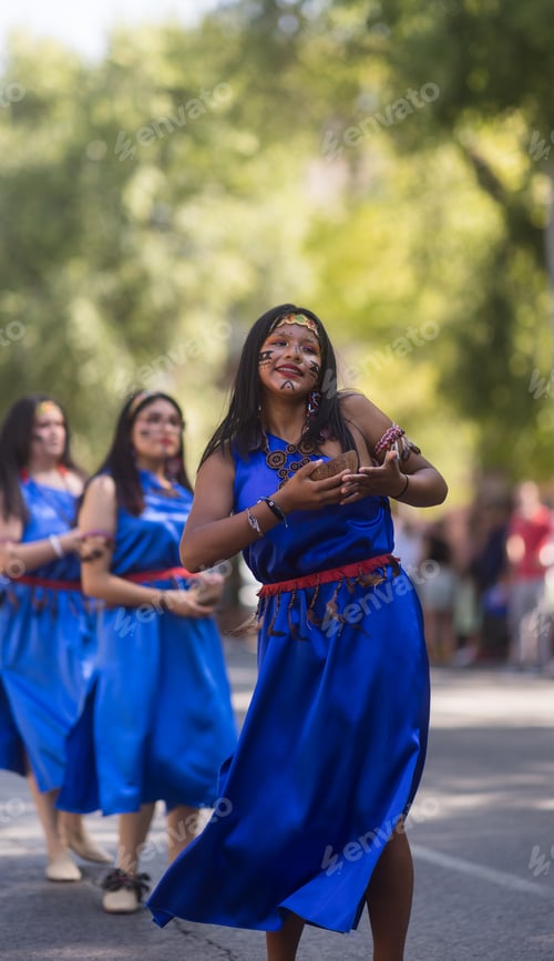 Preview: Indigenous woman dancing in traditional Shuar clothes during hispanicity day parade