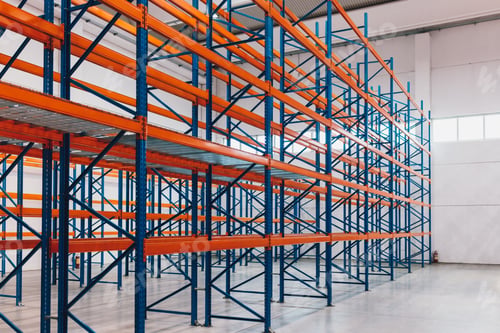 Preview: Empty Industrial Storage Racks in a Spacious Warehouse Environment