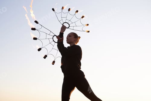 Preview: Woman Dancing with Fire Fans on Sky During Fire Show