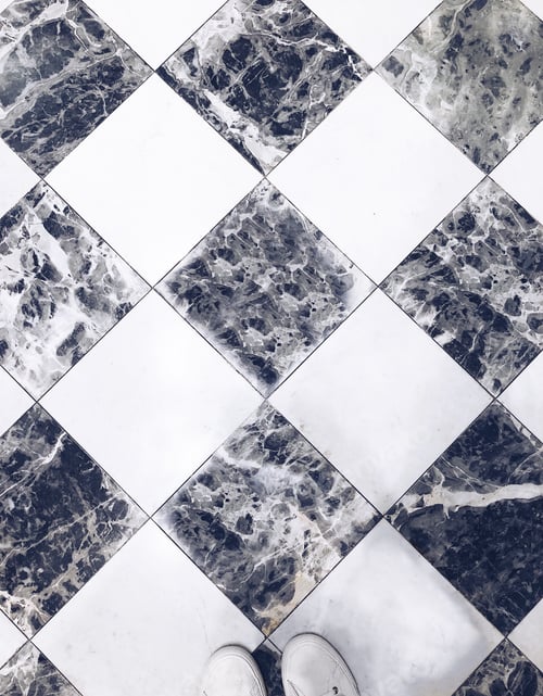 Preview: Black and white checkered marble floor with two visible human feet